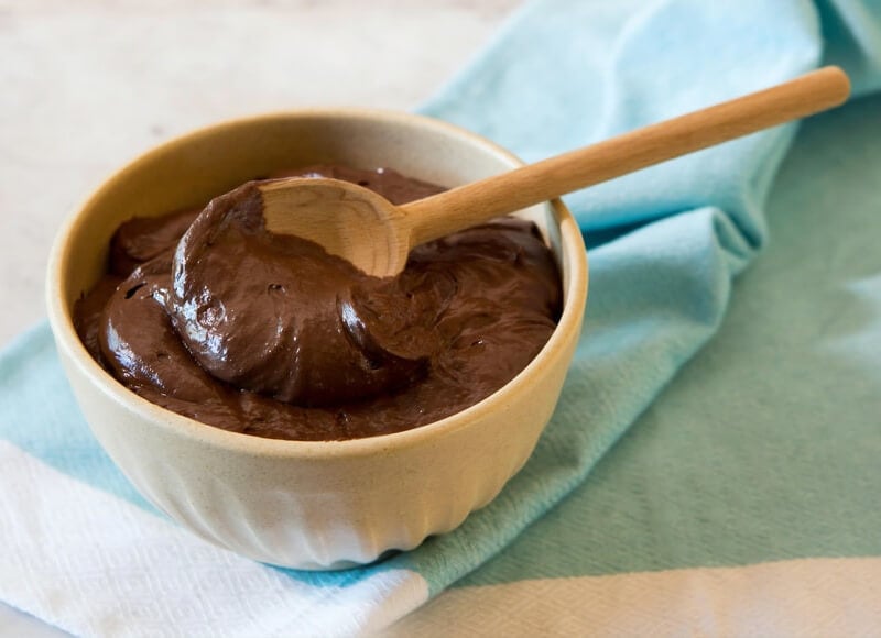 A closeup of a bowl of melted chocolate